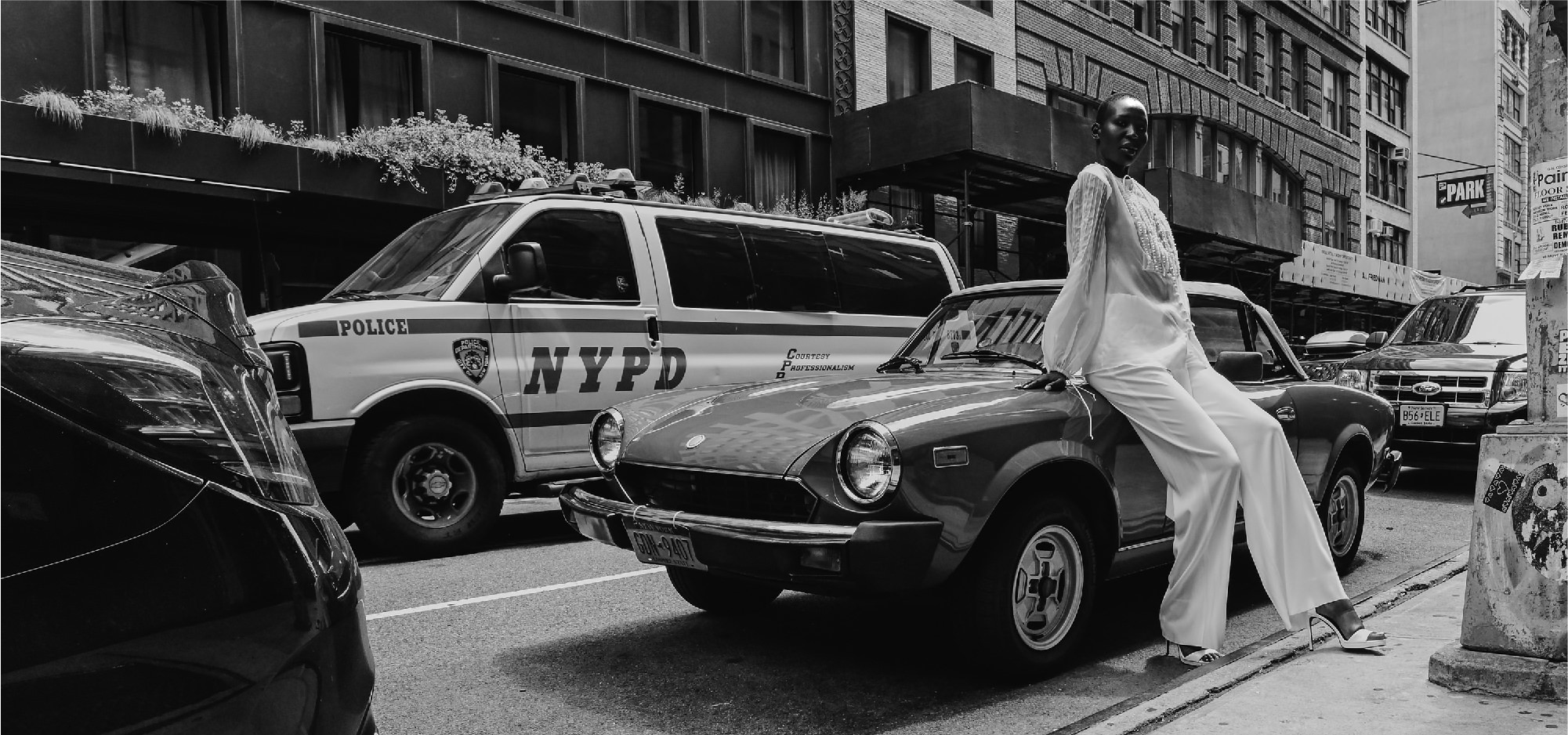 Black & white editorial style bride with wedding dress posing at New York City streets