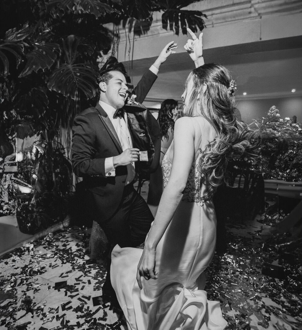 Wedding photographer review of Couple partying with friends during wedding celebration