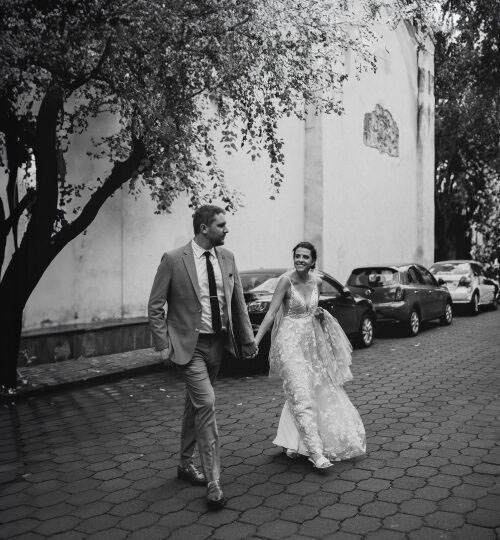Documentary Wedding Photography of a couple strolling outside after wedding ceremony.