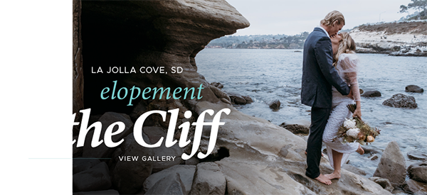 Bride and groom standing barefoot on rocky cliffside with bouquet.